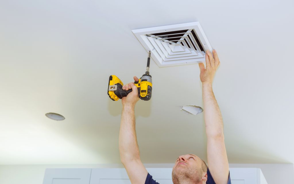 Bathroom ventilation system being installed